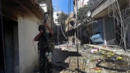 Soldados sirios durante un patrullaje en un área de Damasco (Siria) en noviembre de 2012 