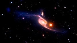 La galaxia NGC 6872 fotografiada por la NASA.