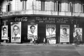 Coca-Cola se anuncia sobre carteles electorales en el Paseo del Prado, de la campaña para elecciones generales y presidenciales de noviembre de 1954.