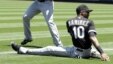 Alexei Ramirez (R)  durante un encuentro con equipo dominicano