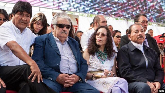 Los mandatarios Evo Morales (Bolivia), José Mujica (Uruguay) y Daniel Ortega (Nicaragua) en un acto en Caracas de apoyo al chavismo.